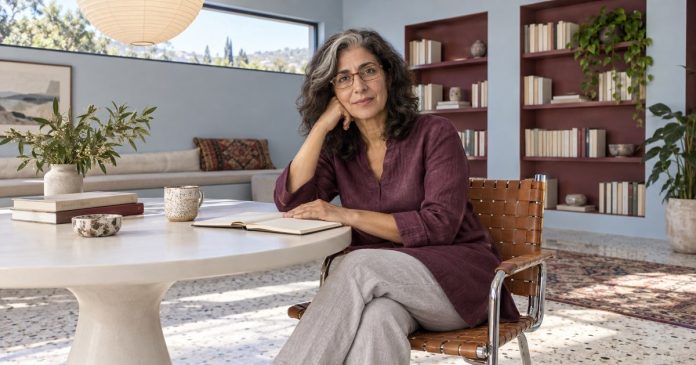 Mature woman reviewing a notebook in a bright reading room